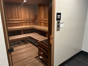 A sauna room with wooden benches and a control panel. -  Decatur near Emory University and hospital (Decatur)