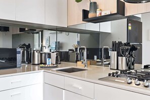 Fridge, microwave, oven, stovetop - Renovated 2-Bed Apartment with Balcony (St Kilda)
