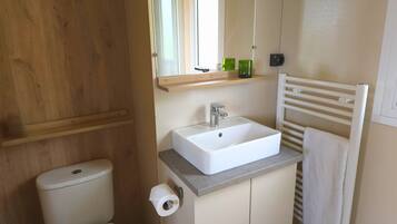 Shower, hair dryer, towels, toilet paper