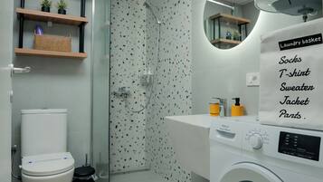 Shower, hair dryer, towels, shampoo