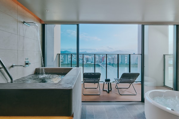 Sauna Suite, Non Smoking | Bathroom | Separate tub and shower, hair dryer, slippers, bidet