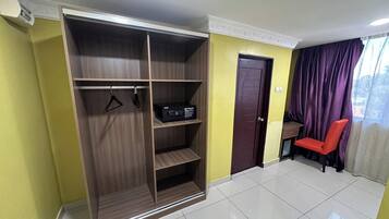 Family Room | Minibar, in-room safe, desk, blackout drapes