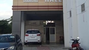 A building with a sign reading "RESIDENCY" and "Dhanalakshmi Diamond Hall". - J Residency (Pochampalli)