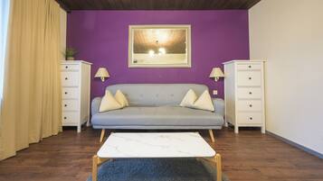 Quadruple Room, Balcony | Living area