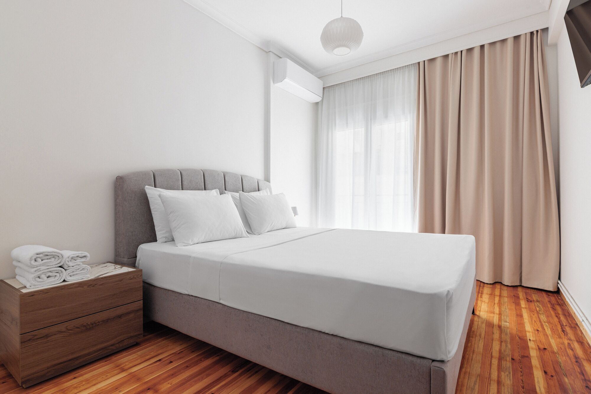 Apartment, 2 Bedrooms, Balcony, City View | Desk, laptop workspace, blackout drapes, iron/ironing board