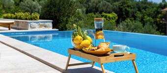 Spacious 4-bedroom villa with private heated pool, spa zone, and gym.