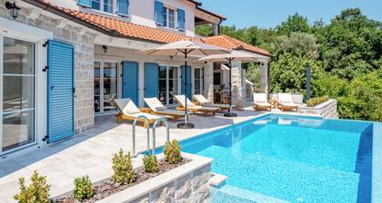 Spacious 4-bedroom villa with private heated pool, spa zone, and gym.