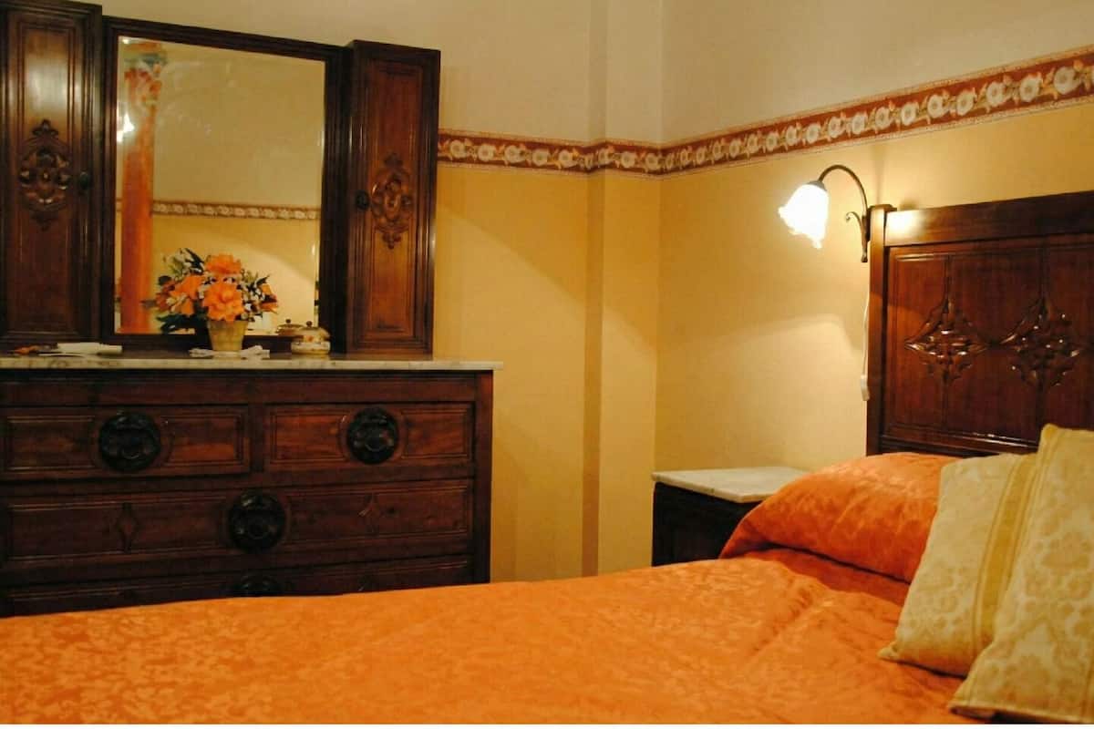 Deluxe Room, Balcony, Garden View | In-room safe, desk, laptop workspace, blackout drapes