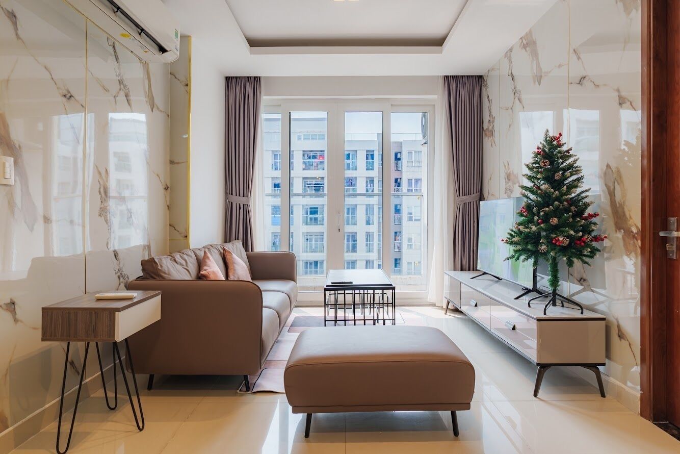 Family Apartment, Balcony, Pool View | Living area | 50-inch LED TV with digital channels