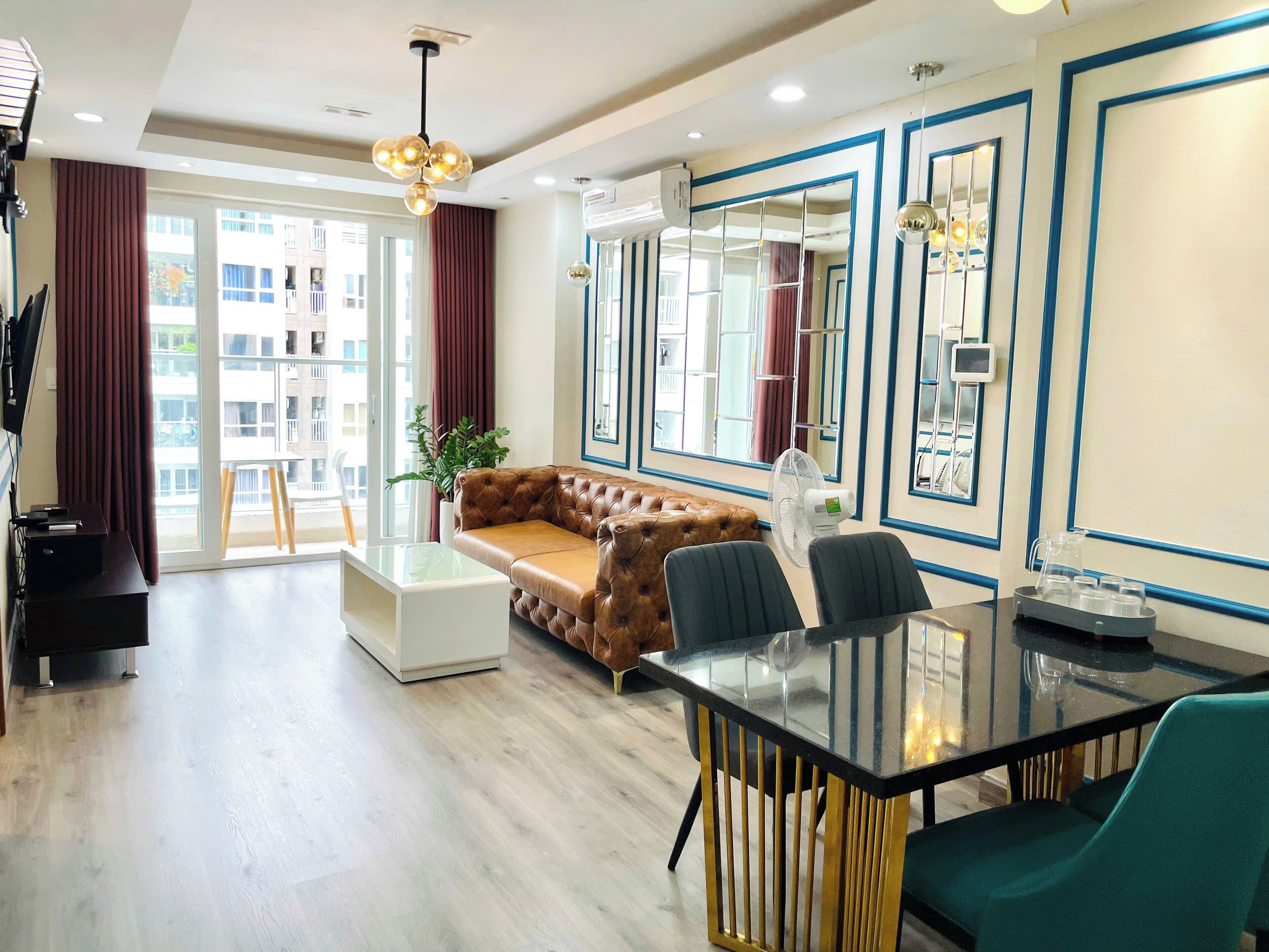 Family Apartment, 2 Bedrooms, Balcony, Pool View | Living area | 50-inch LED TV with digital channels