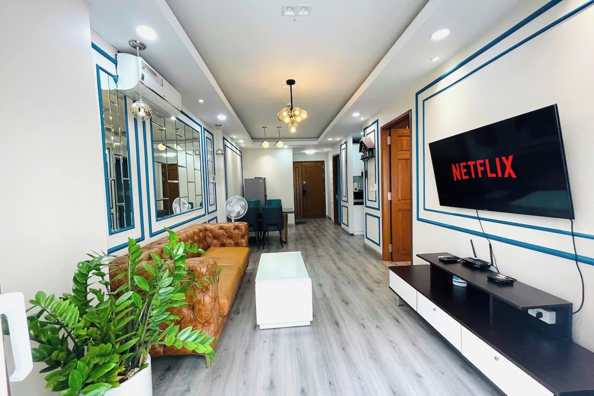 Family Apartment, 2 Bedrooms, Balcony, Pool View | Living area | 50-inch LED TV with digital channels