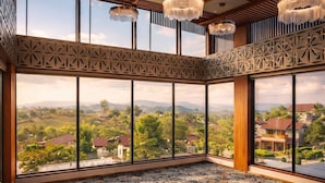 A spacious room with large windows, a patterned carpet, and hanging chandeliers. - WelcomHeritage Akashganga Resort & Spa (Bichhiwara)