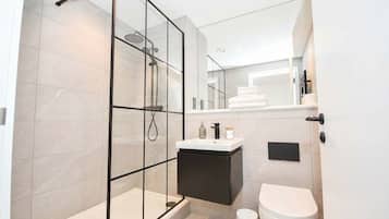 Shower, hair dryer, towels, shampoo