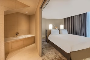 Suite | Minibar, in-room safe, desk, laptop workspace - Radisson Blu CDG Airport Terminal Hotel, Paris (Tremblay-en-France)