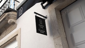 A black sign with white text indicating 'ANDO Living São Miguel House'. - Ando Living - São Miguel House - 203 (Porto)
