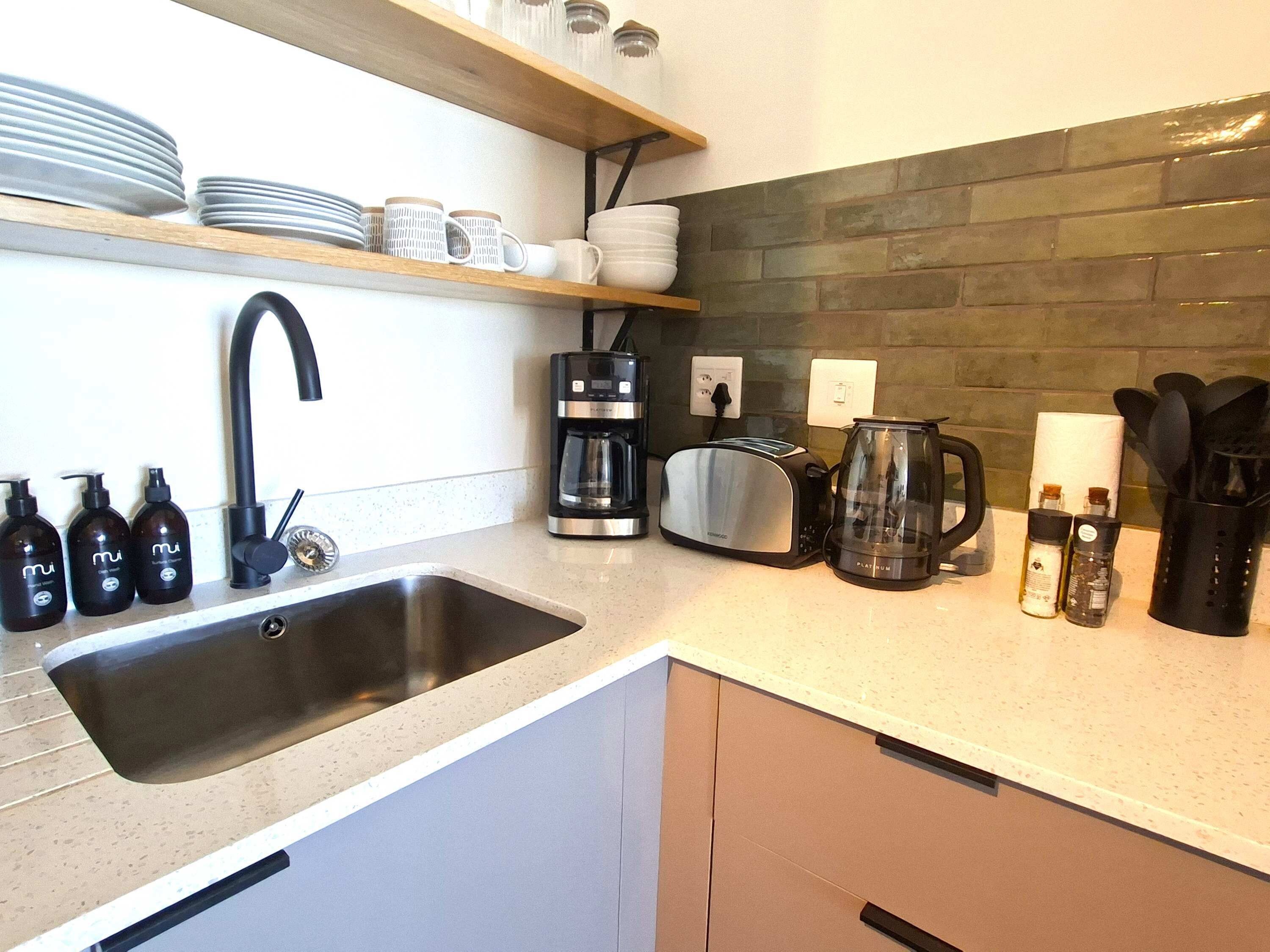 Coffee/tea maker, fridge, microwave, oven