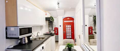 Fridge, microwave, stovetop, coffee/tea maker