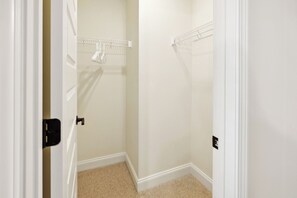 A narrow hallway with a closet on one side and a door on the other. - Alto O4 I Modern New Construction 2Bd Apartment (Clarksville)