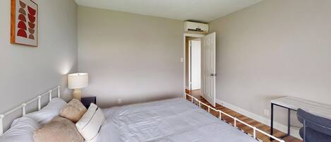 1 bedroom, desk, iron/ironing board, travel crib