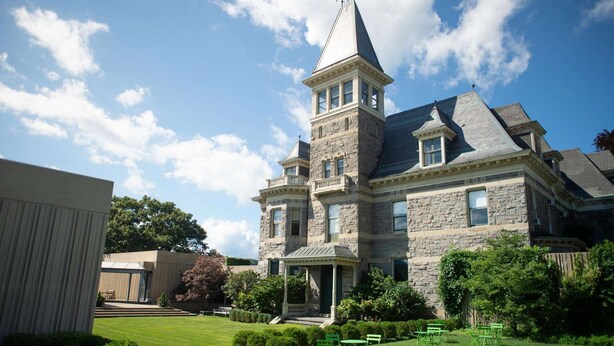 A large stone building with a prominent tower and a covered porch. - Near Ridge Hill shopping. Breakfast. Pool. Bar. (Yonkers)