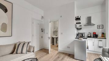 Apartment, 2 Bedrooms, Non Smoking, Kitchenette | Living area | 50-inch flat-screen TV with cable channels