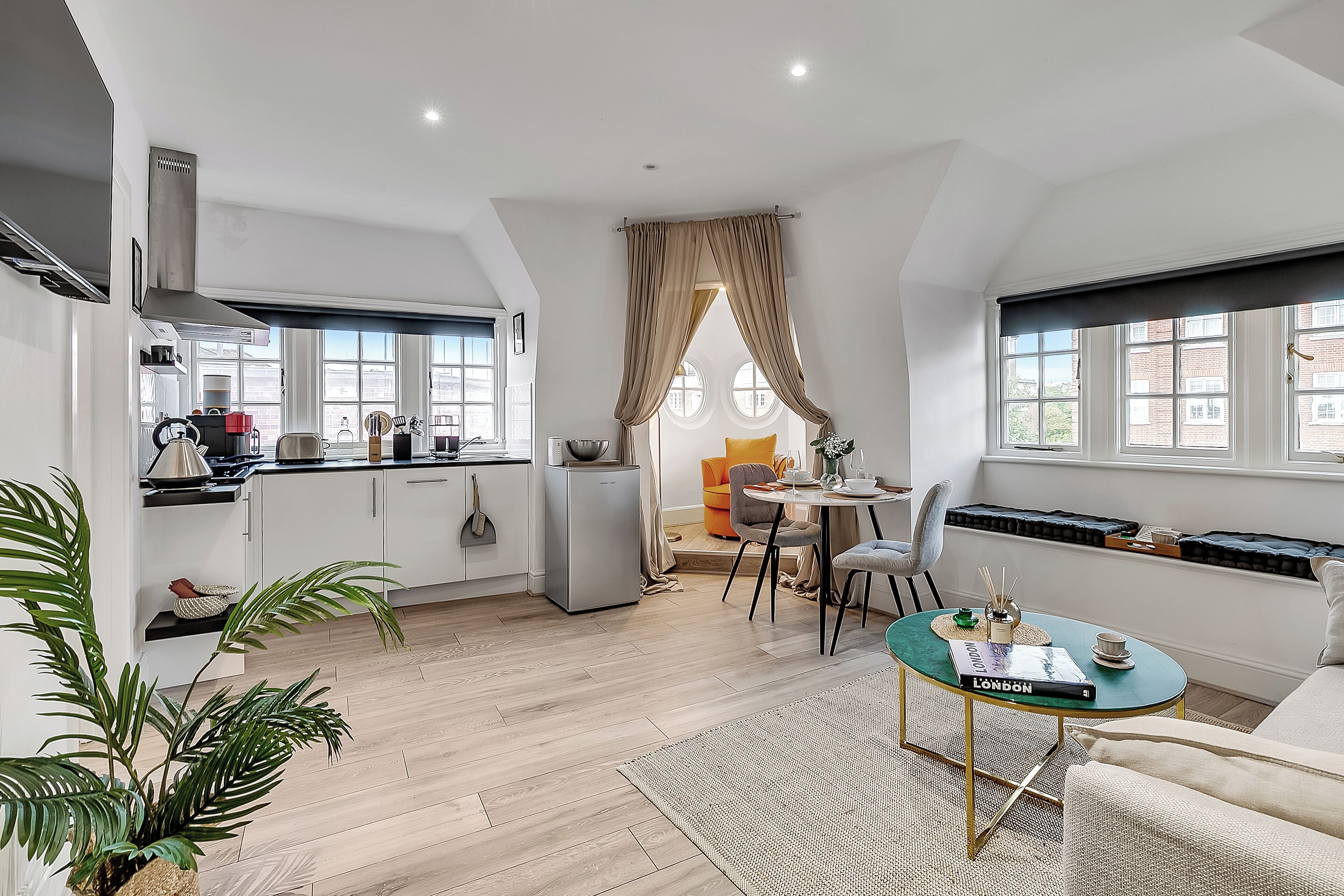 Apartment, 1 Bedroom, Kitchenette | Living area | 50-inch flat-screen TV with cable channels