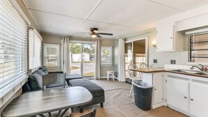A compact kitchen with a dining area, a ceiling fan, and a view of the outside. - Resort Amenities, 7 Mi to Dtwn: Sarasota Home! (Sarasota)