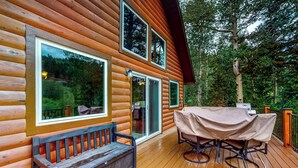 A wooden cabin with a deck, a covered table, and a bench. - Deck & Mtn Views! Family A-frame Cabin Near Stream (Bailey)