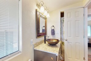 A bathroom with a large mirror, a vessel sink, and a towel rack. - Manufactured w/ Pools, Hot Tubs, Pickleball, AC (Surprise)