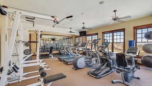 A gym with treadmills, elliptical machines, and weight equipment. - Granby Ranch Condo w/ Mtn-view: Trails & Hot-tub! (Granby)