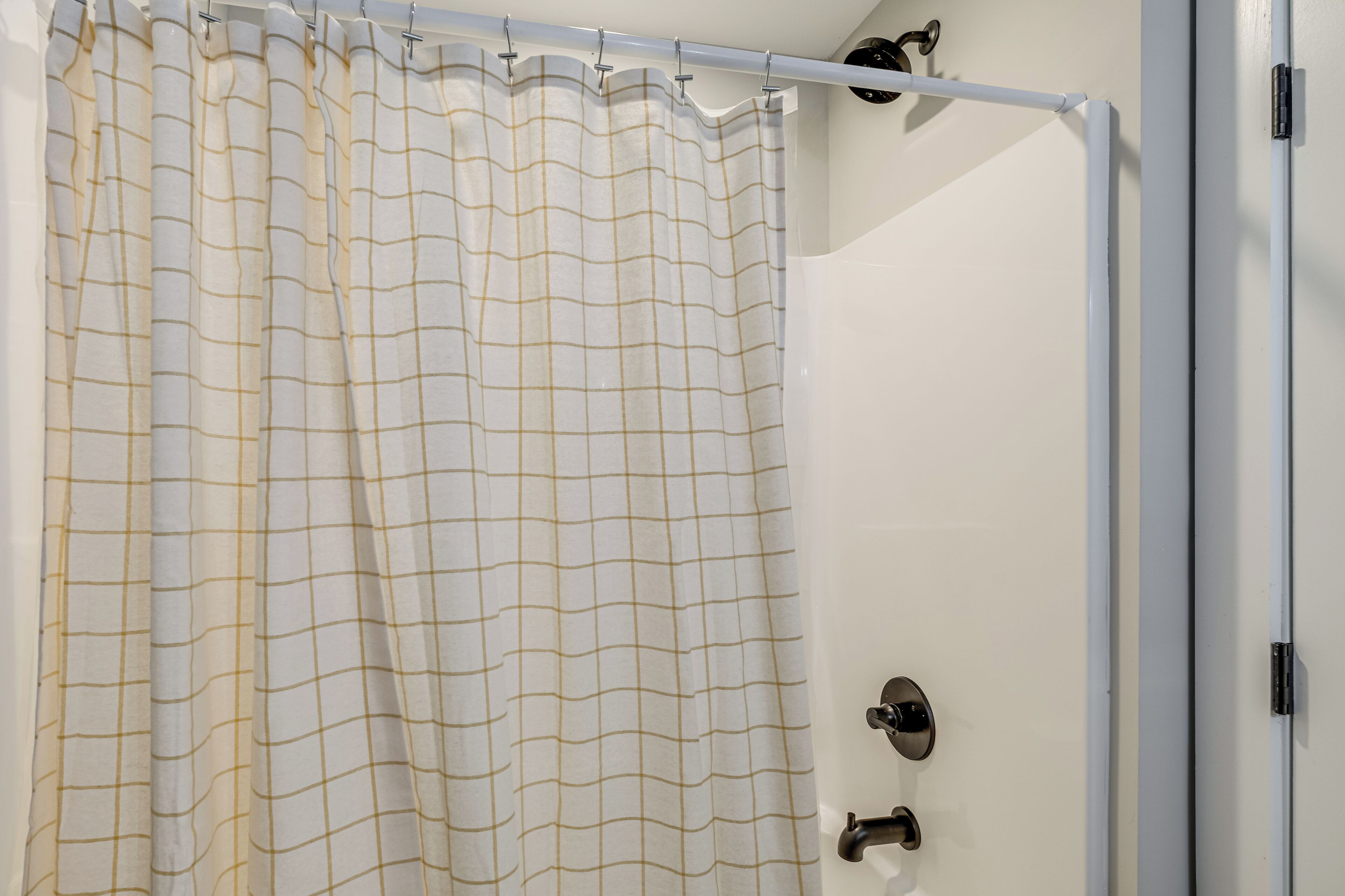 A shower curtain with a grid pattern.