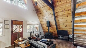 A cozy living room with a fireplace, leather sofas, and a wooden ceiling. - Fire Pit! A-frame Escape, 33 Mi to Sunrise Park (Pinetop)