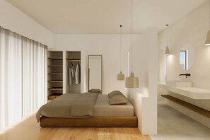 A modern bedroom with a bed, built-in wardrobe, and a bathroom with a vanity and mirror.