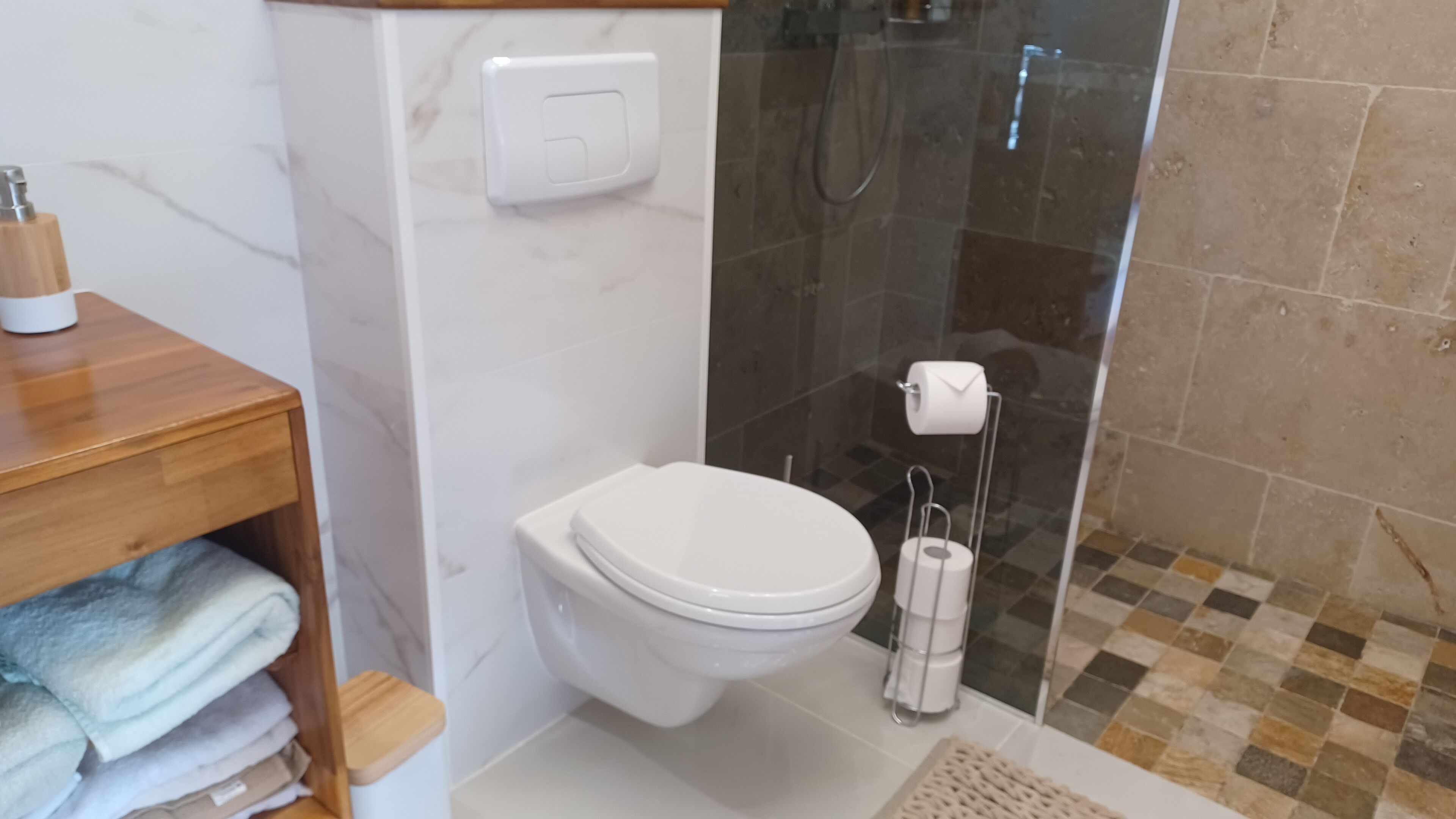 Shower, hair dryer, towels, soap