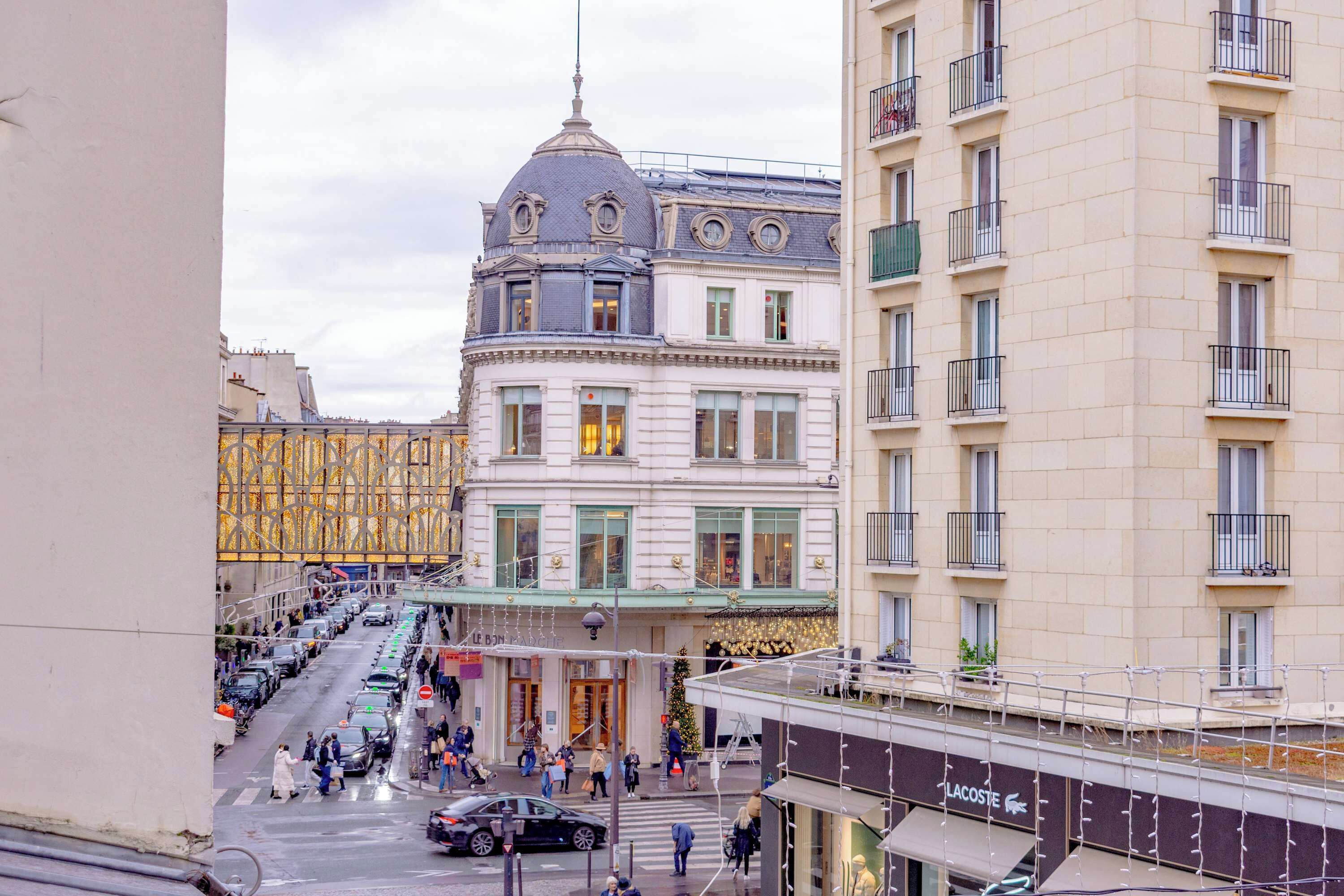 A hotel with a classic European architectural style, featuring a prominent dome and a corner entrance.