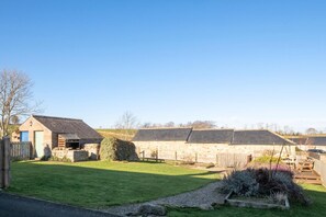 A rural property with stone buildings, a grassy yard, and a wooden fence. - 2 Bed in Chatton (oc-nb620) (Chatton)