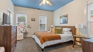 A bedroom with a bed, dresser, nightstand, and ceiling fan. - Historic south park gem - close to UD, MVH & more. (Dayton)
