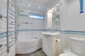A modern bathroom with a freestanding bathtub, a sink, and a toilet. - 1 Bed in St Ives (oc-nicc41) (Saint Ives)