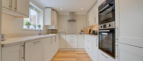 Oven, dishwasher, high chair, cookware/dishes/utensils