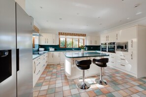 Oven, dishwasher, high chair, cookware/dishes/utensils