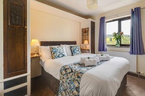 Tabla de planchar con plancha, wifi gratis y ropa de cama 