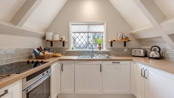 Oven, dishwasher, high chair, cookware/dishes/utensils