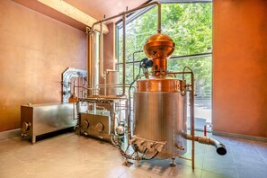 A distillation apparatus in a room with large windows and a view of greenery outside. - 1 Bed in Weeton (oc-c32015) (Weeton-with-Preese)
