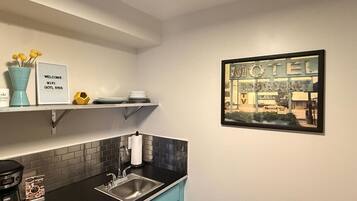 Microwave, coffee/tea maker, cookware/dishes/utensils, paper towels