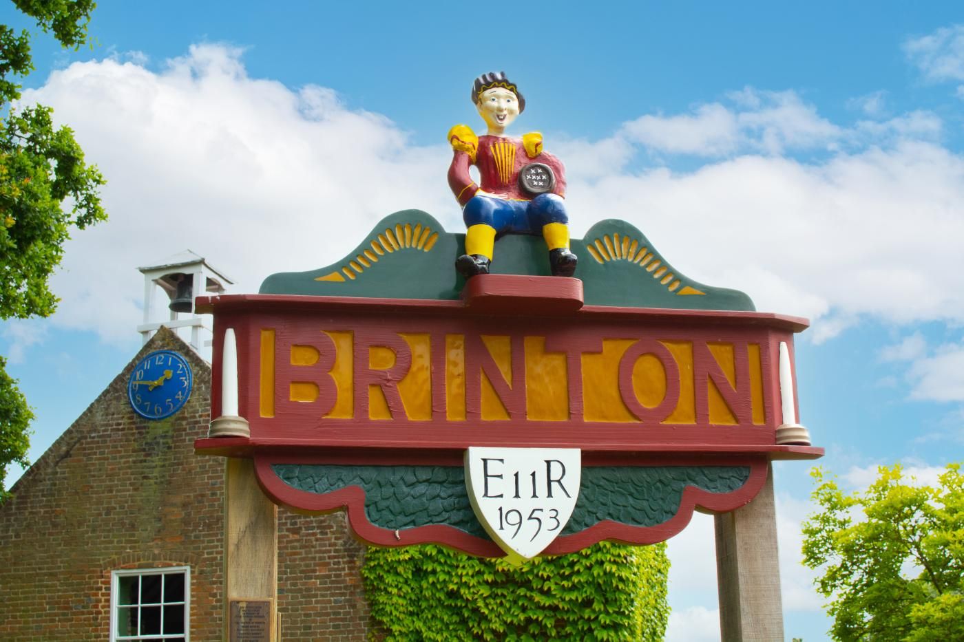A colorful sign with the word 'BRINTON' and a figure of a person.