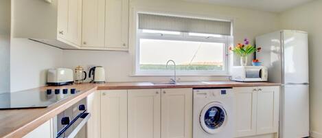 Microwave, oven, high chair, cookware/dishes/utensils