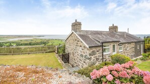 A stone house with a view of a river and fields. - 1 Bed in Llanfair (oc-b32109) (Llanfair)