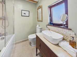 A bathroom with a glass-enclosed shower, a white sink with a stone countertop, a toilet, and a mirror above the sink. - 2 Bed in Whitby (oc-w014) (Whitby)