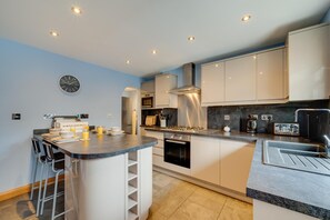 Oven, dishwasher, highchair, cookware/dishes/utensils