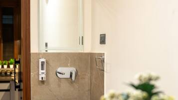 Shower, hair dryer, towels, soap